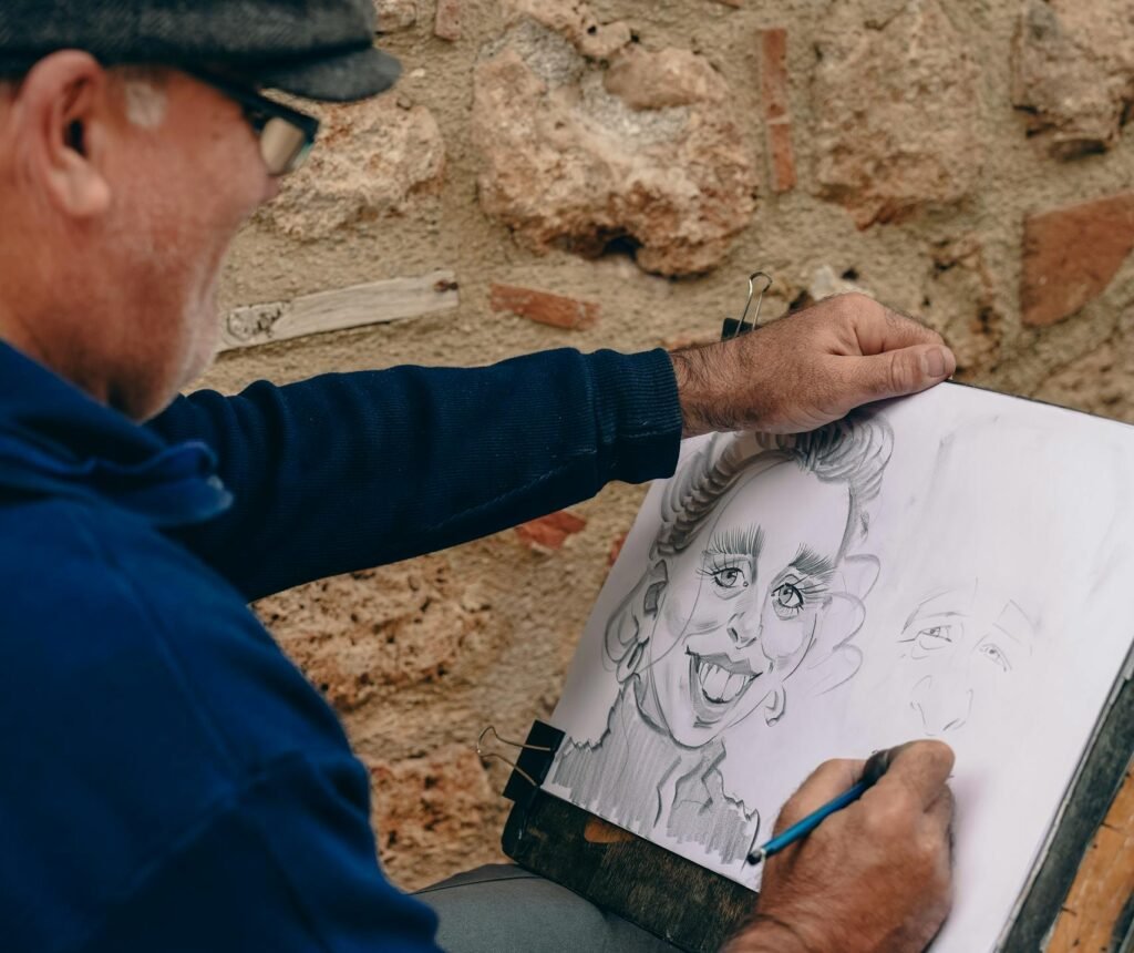 Aménagement appartement Street artist draws a whimsical charcoal portrait of a man outdoors.